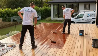 Redmond, WA painters staining a wooden deck for weather protection and curb appeal